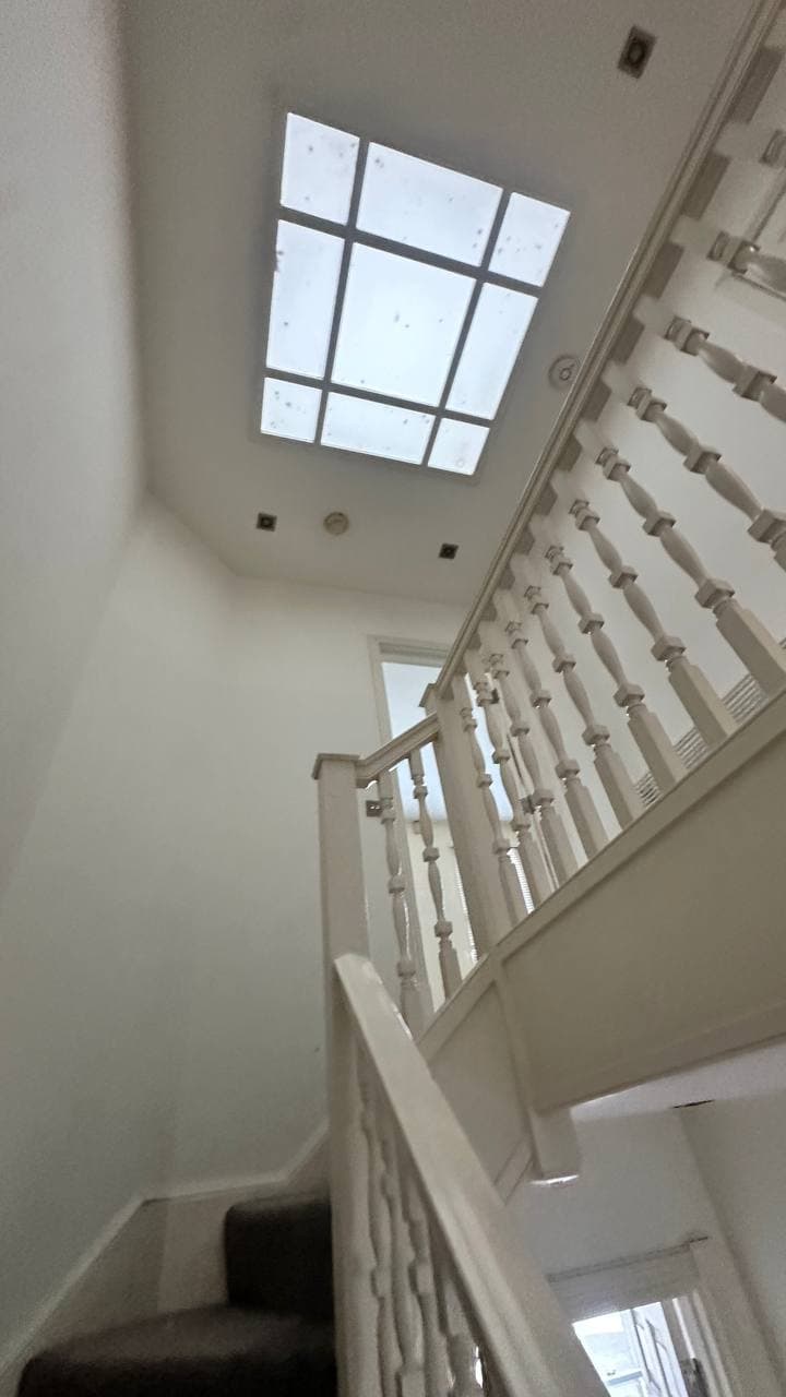 Restored staircase below a rooflight