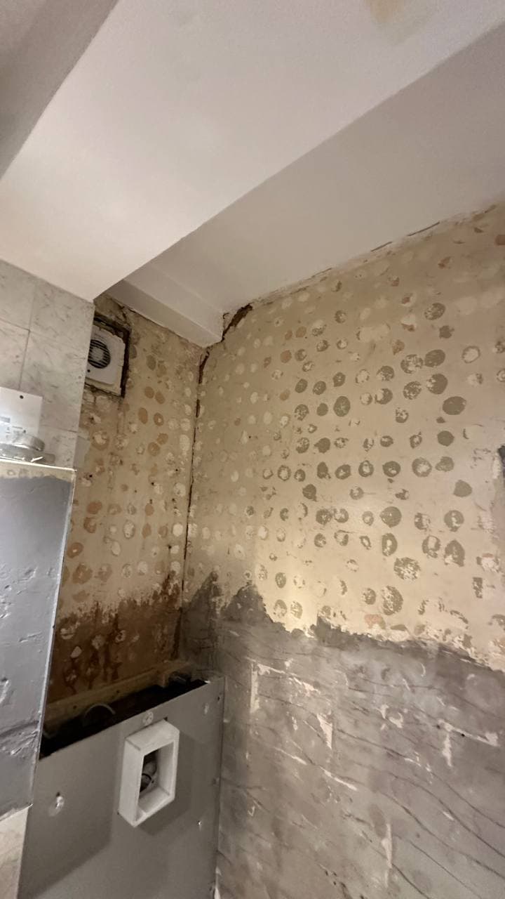 Bathroom walls stripped back and prepared for new finishes